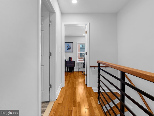 418 E Lanvale St, Baltimore, MD 21202 - hall with an upstairs landing, light wood-style flooring, recessed lighting, and baseboards