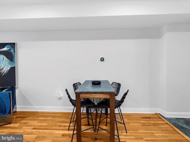 418 E Lanvale St, Baltimore, MD 21202 - dining room with wood finished floors and baseboards