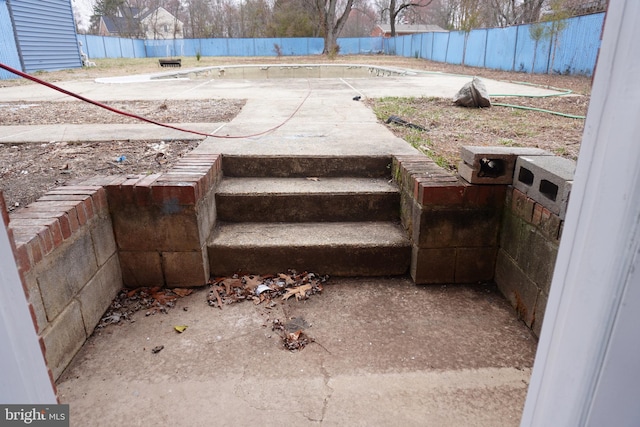view of patio / terrace featuring fence