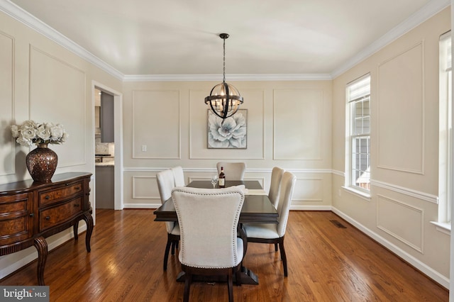 9609 Low Meadow Dr, Gaithersburg, MD 20882 - dining room featuring a decorative wall, a chandelier, dark wood-style floors, and crown molding