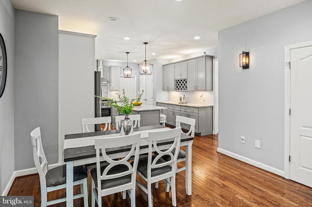9609 Low Meadow Dr, Gaithersburg, MD 20882 - dining space with baseboards, wood finished floors, and recessed lighting