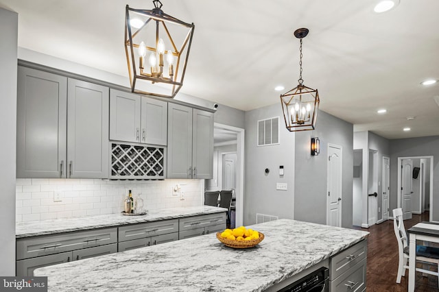 9609 Low Meadow Dr, Gaithersburg, MD 20882 - kitchen with a chandelier, gray cabinets, tasteful backsplash, and recessed lighting