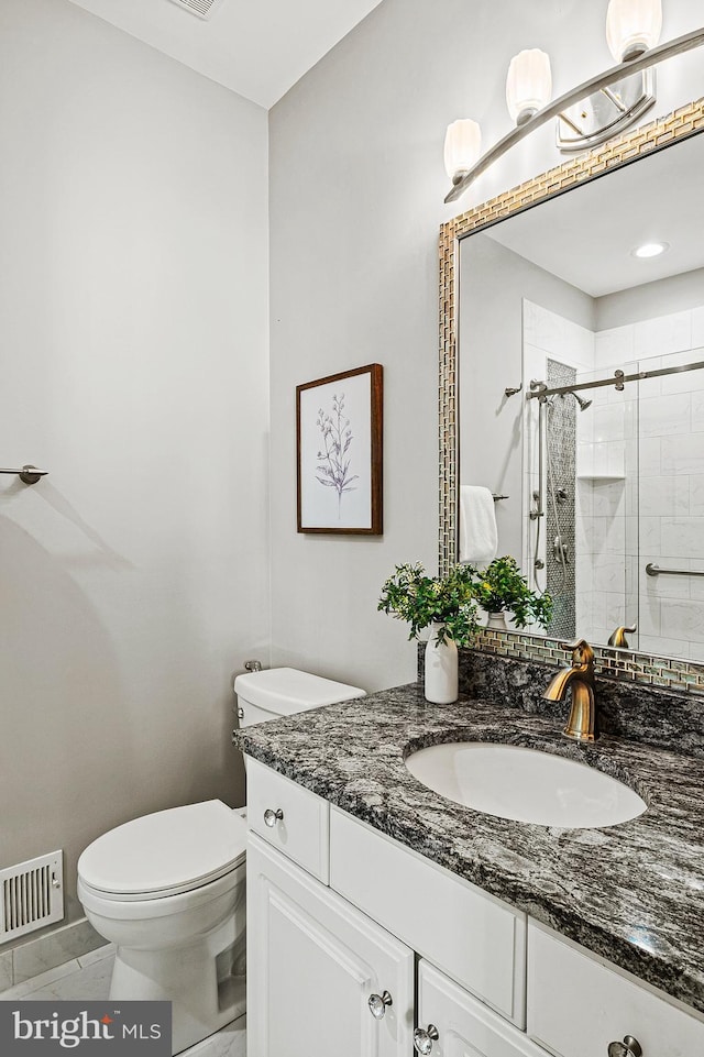 9609 Low Meadow Dr, Gaithersburg, MD 20882 - bathroom featuring vanity, toilet, and a shower stall