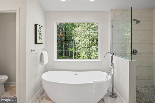 9609 Low Meadow Dr, Gaithersburg, MD 20882 - full bath featuring marble look tiles, a freestanding bath, a walk in shower, baseboards, and recessed lighting