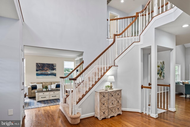 9609 Low Meadow Dr, Gaithersburg, MD 20882 - staircase with wood finished floors, a high ceiling, baseboards, and recessed lighting