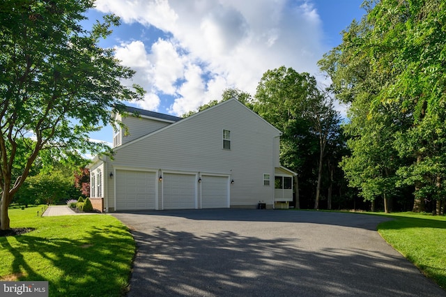 9609 Low Meadow Dr, Gaithersburg, MD 20882 - view of home's exterior featuring driveway, a yard, and an attached garage