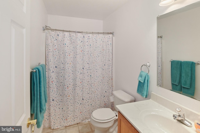 full bathroom with tile patterned flooring, toilet, vanity, and a shower with curtain