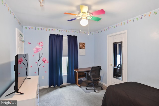bedroom featuring baseboards, light carpet, and a ceiling fan