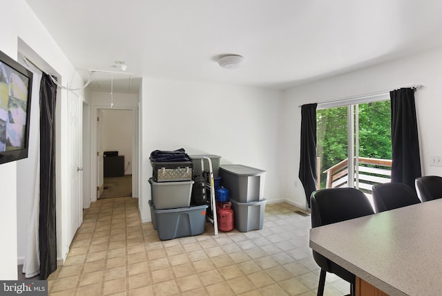 office area featuring attic access and baseboards