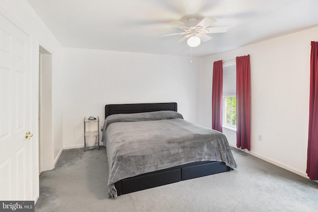 bedroom with carpet, baseboards, and a ceiling fan