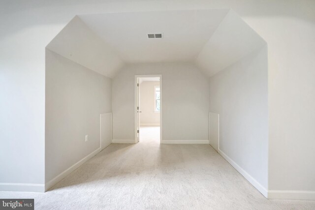 bonus room featuring vaulted ceiling, baseboards, and carpet floors