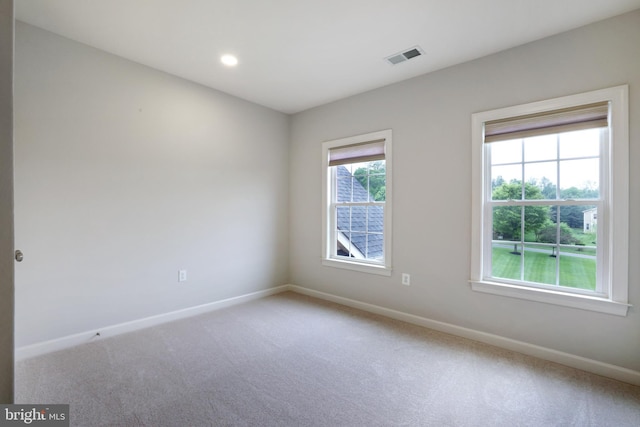 unfurnished room with baseboards, carpet floors, and recessed lighting
