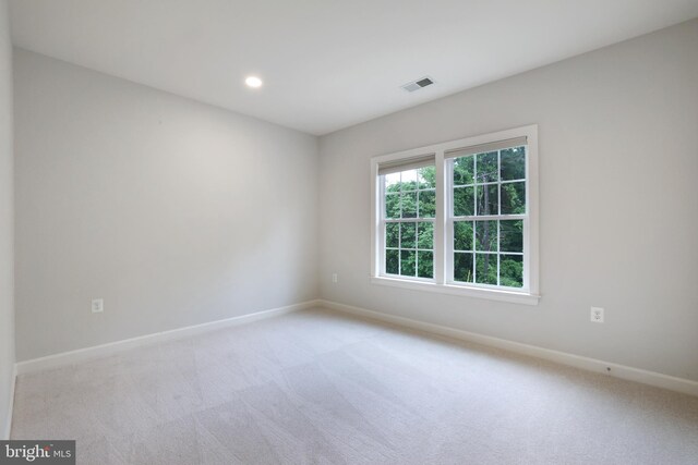 unfurnished room featuring baseboards, carpet floors, and recessed lighting
