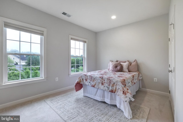 bedroom with light carpet, baseboards, and recessed lighting