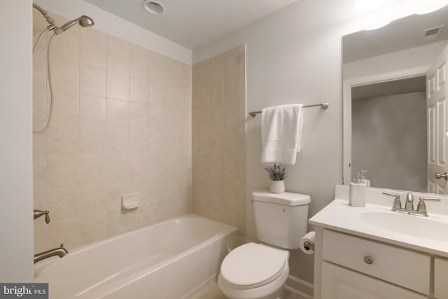 full bath featuring toilet, vanity, and shower / washtub combination