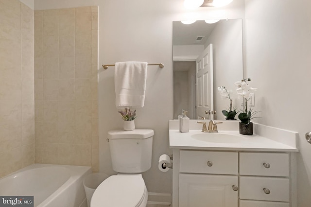 bathroom featuring toilet and vanity