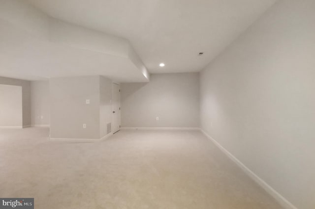 bonus room with baseboards, recessed lighting, and light colored carpet