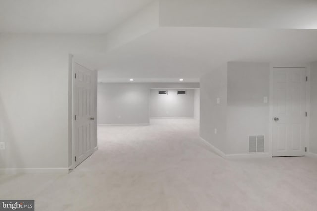 empty room with carpet floors, recessed lighting, and baseboards