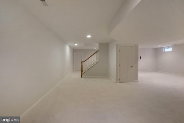 below grade area featuring recessed lighting, stairs, carpet floors, and baseboards