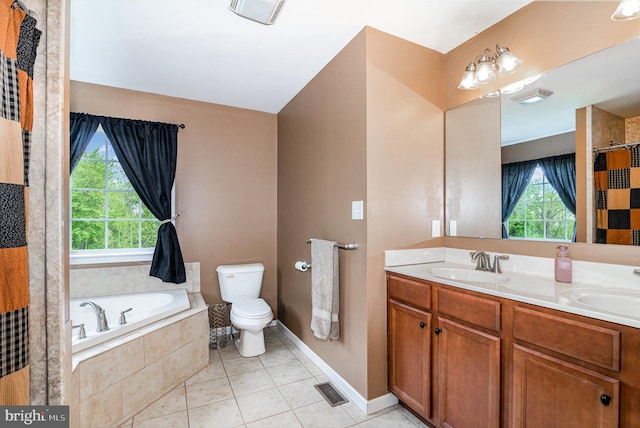 full bathroom with tile patterned floors, double vanity, a garden tub, toilet, and baseboards