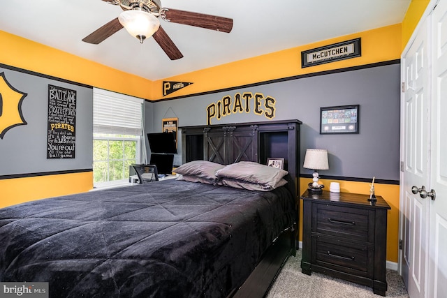 bedroom with carpet, ceiling fan, and baseboards