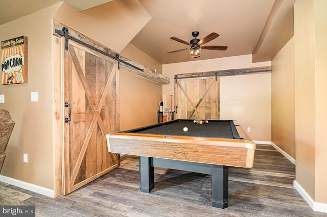 playroom with a barn door, wood finished floors, baseboards, and a ceiling fan