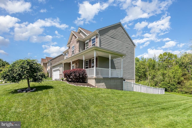 view of front of property with a porch and a garage