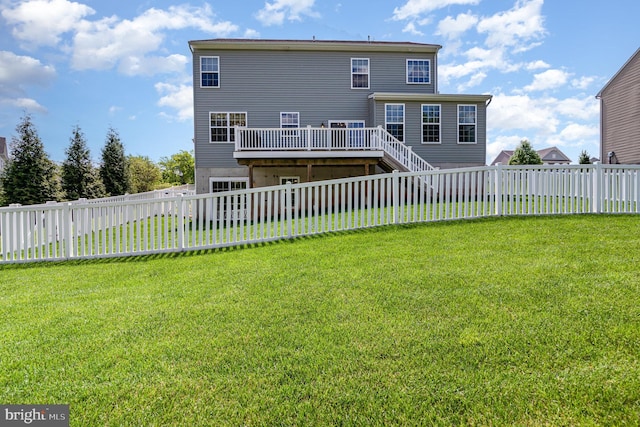 back of house featuring a deck and stairway