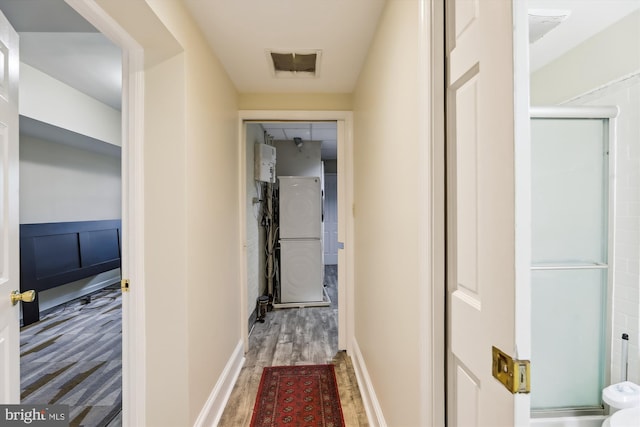 corridor with wood finished floors