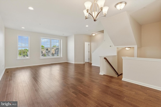 bonus room featuring wood finished floors, a chandelier, baseboards, and recessed lighting