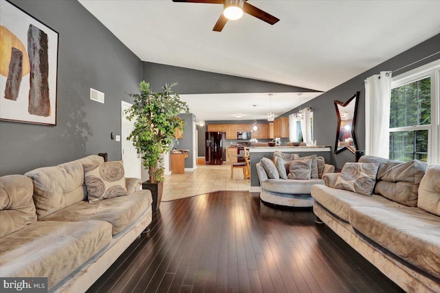 3202 Nash Rd, Reading, PA 19608 - living room with vaulted ceiling, a ceiling fan, and light wood-style floors