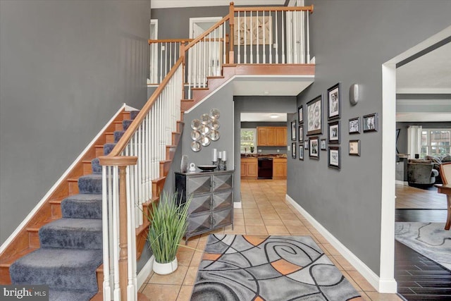 3202 Nash Rd, Reading, PA 19608 - stairway featuring tile patterned flooring, baseboards, and a high ceiling