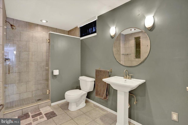 3202 Nash Rd, Reading, PA 19608 - bathroom featuring a stall shower, toilet, baseboards, tile patterned flooring, and a sink