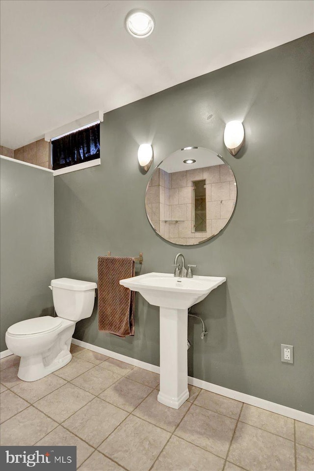 3202 Nash Rd, Reading, PA 19608 - bathroom with tile patterned floors, baseboards, toilet, and a sink
