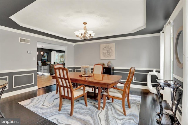3202 Nash Rd, Reading, PA 19608 - dining space with a raised ceiling, a chandelier, a wainscoted wall, ornamental molding, and wood finished floors