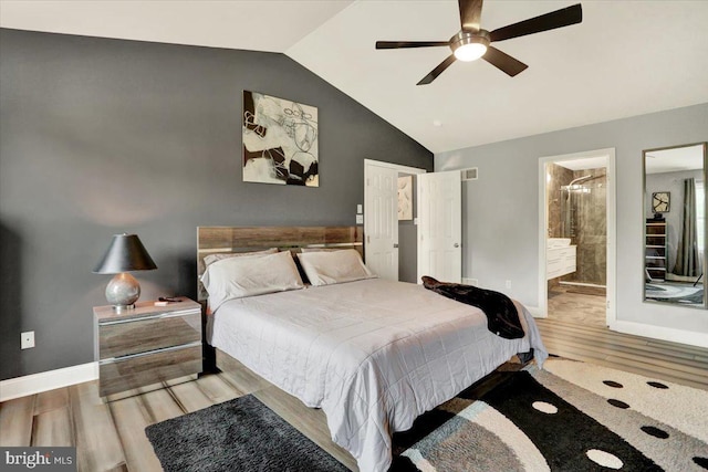 3202 Nash Rd, Reading, PA 19608 - bedroom featuring vaulted ceiling, wood finished floors, baseboards, connected bathroom, and a ceiling fan