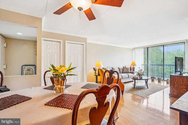 6300 Stevenson Ave Unit 523, Alexandria, VA 22304 - dining space featuring wood finished floors, crown molding, expansive windows, and a ceiling fan