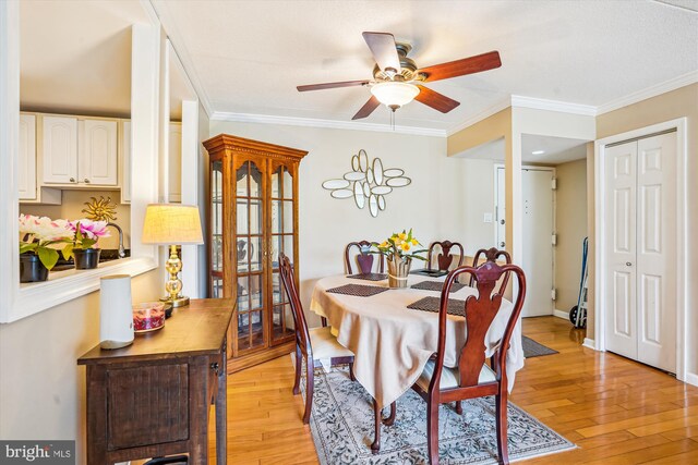 6300 Stevenson Ave Unit 523, Alexandria, VA 22304 - dining space featuring a ceiling fan, light wood-type flooring, crown molding, and baseboards