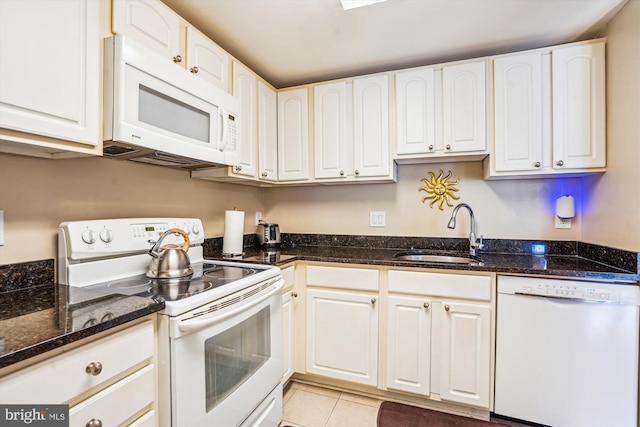 6300 Stevenson Ave Unit 523, Alexandria, VA 22304 - kitchen featuring white appliances, a sink, white cabinetry, dark stone counters, and light tile patterned floors