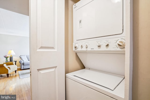 6300 Stevenson Ave Unit 523, Alexandria, VA 22304 - washroom featuring stacked washing machine and dryer and light wood-style floors