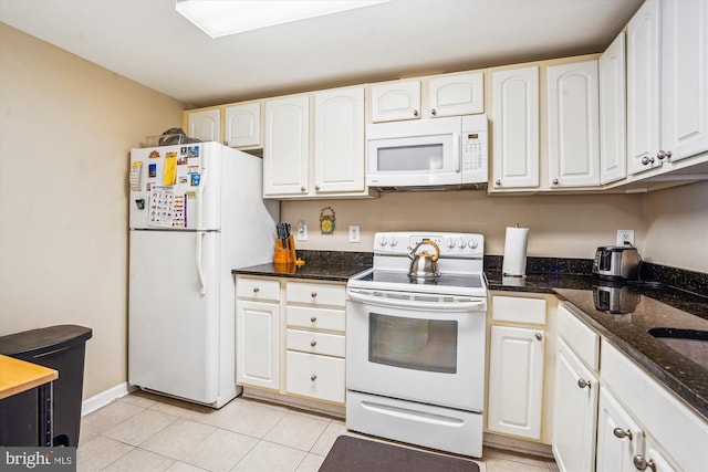6300 Stevenson Ave Unit 523, Alexandria, VA 22304 - kitchen featuring white appliances, white cabinets, dark stone counters, and light tile patterned floors