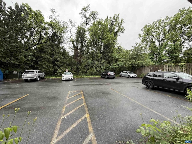 2108 Jefferson Park Ave, Charlottesville, VA 22903 - uncovered parking lot with fence