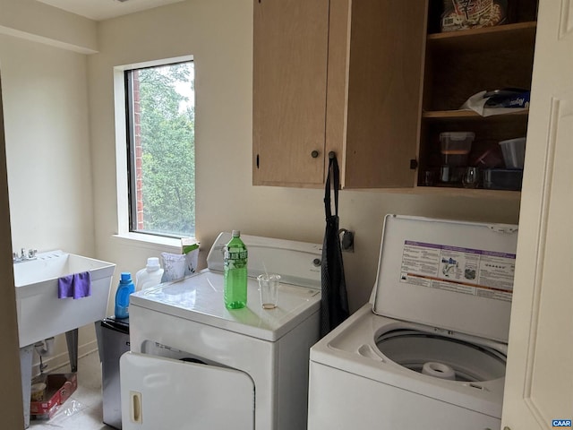 2108 Jefferson Park Ave, Charlottesville, VA 22903 - laundry room with washing machine and dryer, cabinet space, and plenty of natural light