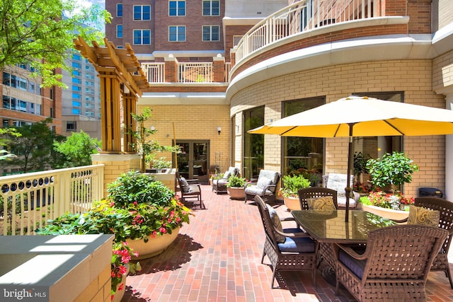 900 N Taylor St Unit 731, Arlington, VA 22203 - view of patio / terrace featuring a balcony, outdoor dining area, and french doors