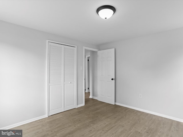 230 Allison Ave, Winchester, VA 22601 - unfurnished bedroom with wood finished floors and a closet