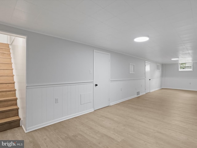 230 Allison Ave, Winchester, VA 22601 - below grade area featuring stairway, wood finished floors, and a wainscoted wall