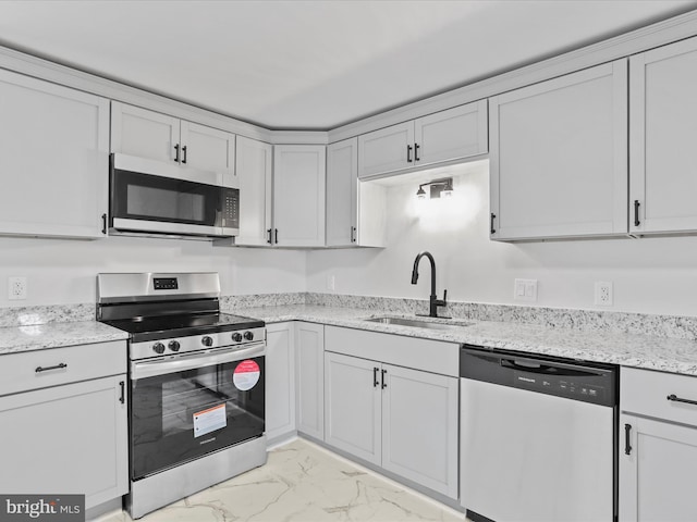 230 Allison Ave, Winchester, VA 22601 - kitchen with appliances with stainless steel finishes, light marble finish floors, and light stone countertops