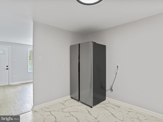 230 Allison Ave, Winchester, VA 22601 - unfurnished bedroom with freestanding refrigerator and light marble finish flooring