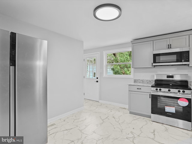 230 Allison Ave, Winchester, VA 22601 - kitchen featuring stainless steel appliances, gray cabinetry, and light marble finish floors
