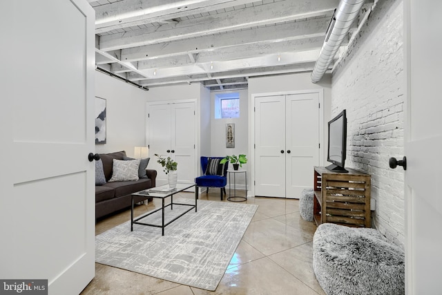 living area featuring beam ceiling